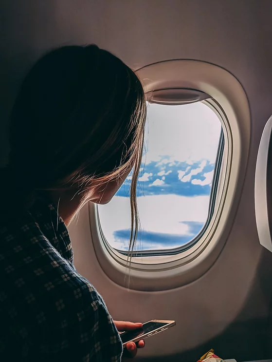 Woman Looking Out Plane