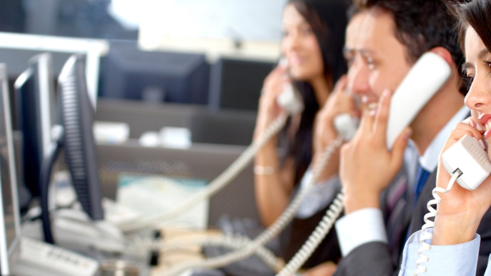 Airline call center agents on phone - reducing call volume using self-service re-accommodation
